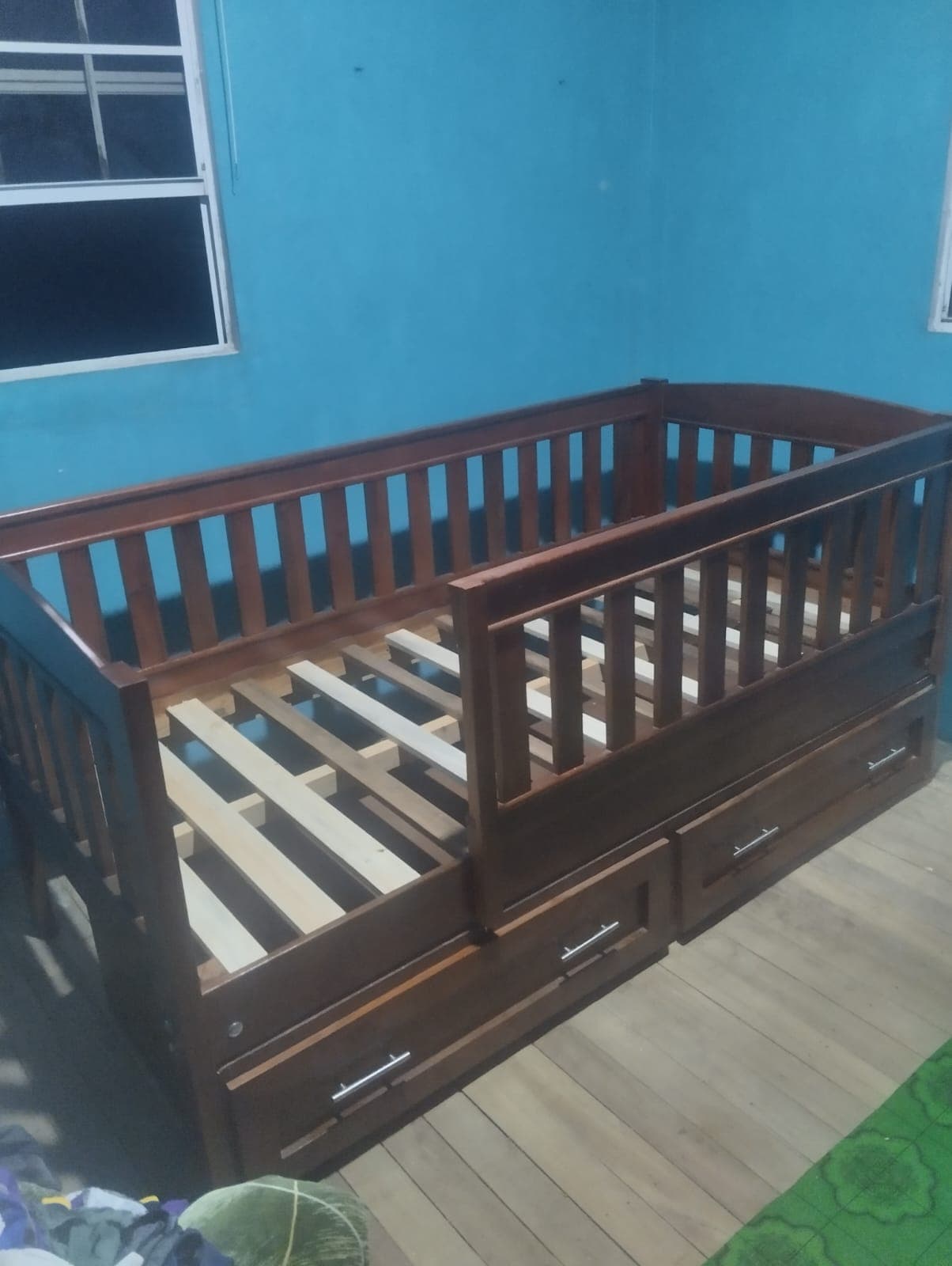 Single size bed with rail and storage